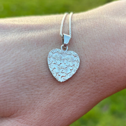 Silver heart pendant with hand engraved flowers