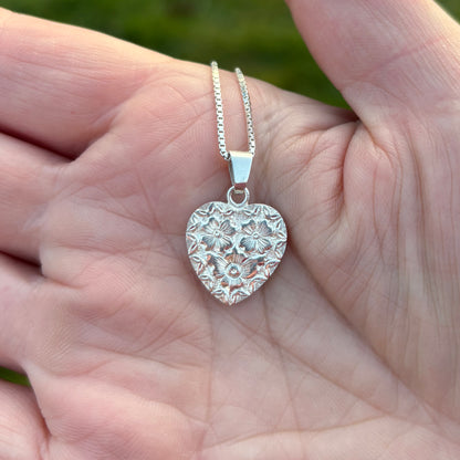 Silver heart pendant with hand engraved flowers