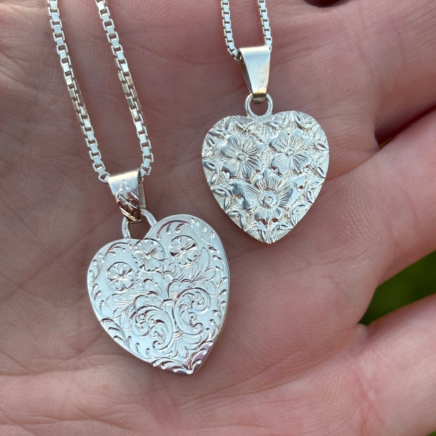 Silver heart pendant with hand engraved flowers
